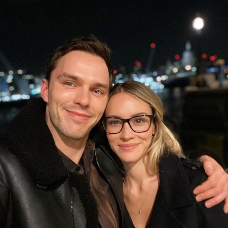 Bryana Holly and her boyfriend Nicholas Hoult in matching black outfit.